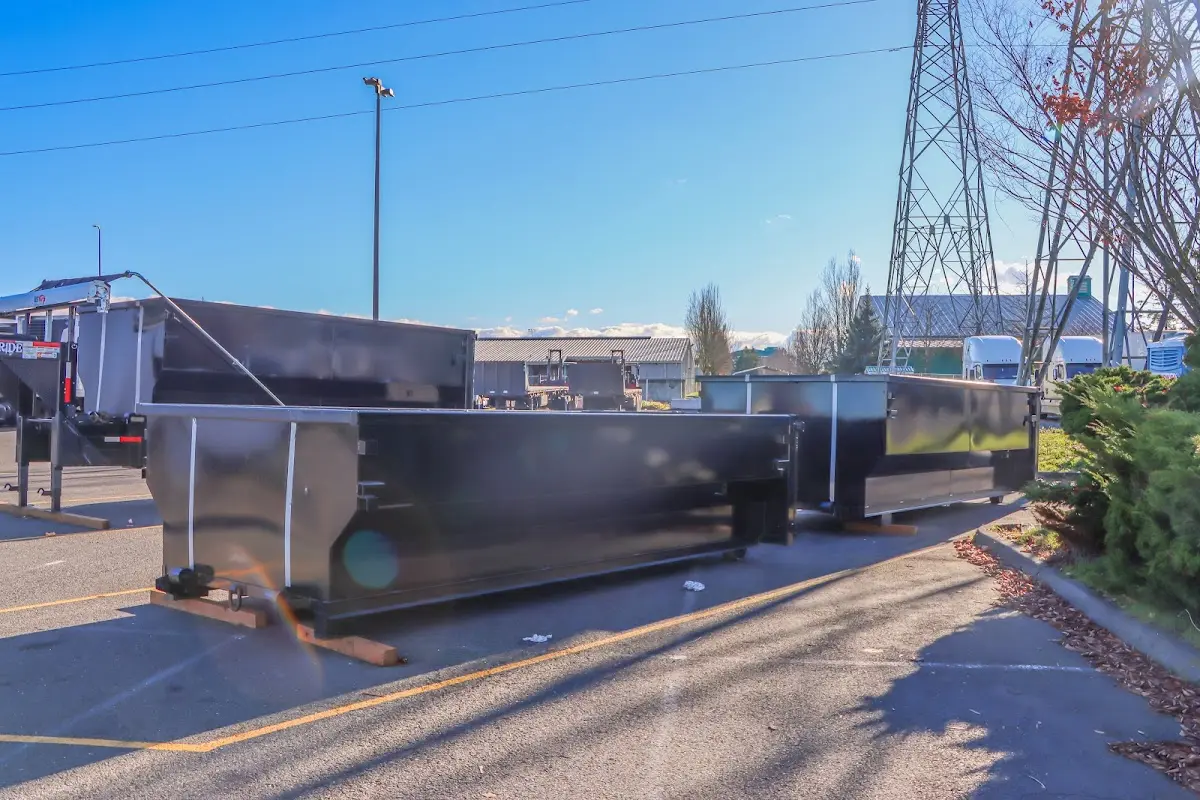 Roll-off dumpster ready for waste disposal at job site for Yard Waste Dumpster Rental in Kelso